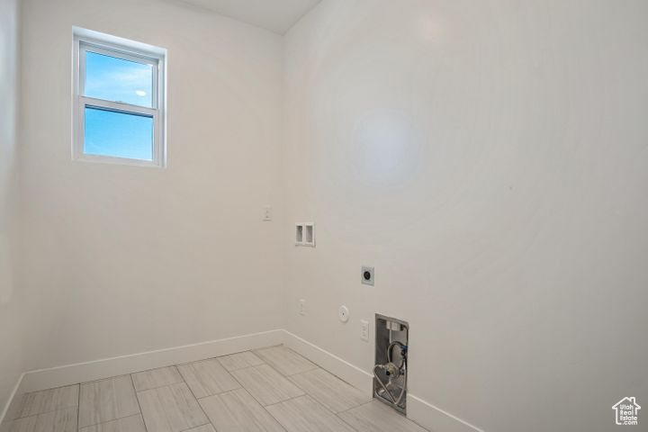 Laundry room featuring washer hookup, gas dryer hookup, and electric dryer hookup