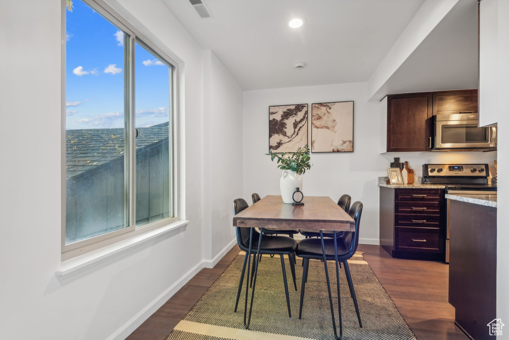 Dining area featuring dark hardwood / wood-style floors