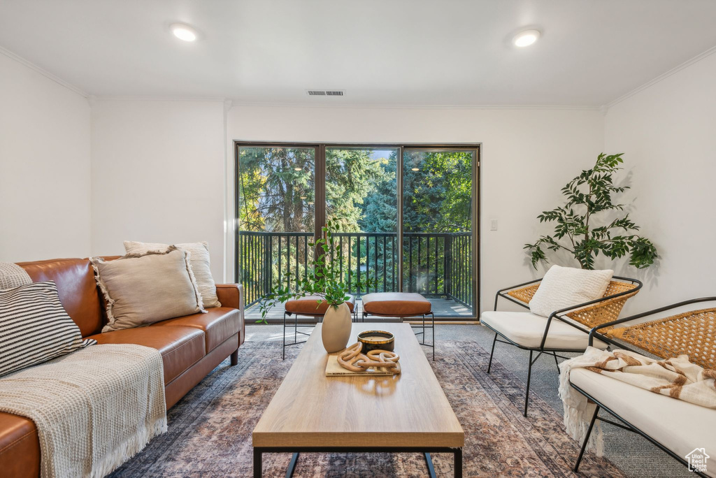 Living room featuring crown molding