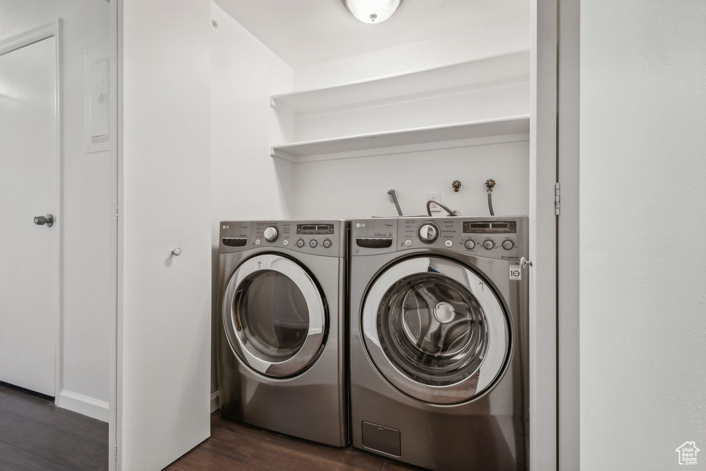 Laundry room featuring separate washer and dryer and dark hardwood / wood-style flooring