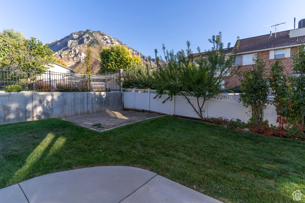 View of yard featuring a patio area and a mountain view