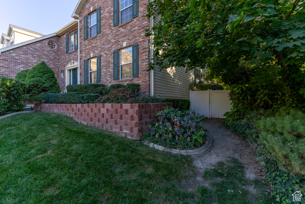 View of home\\\'s exterior with a lawn