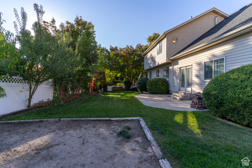 View of yard with a patio area