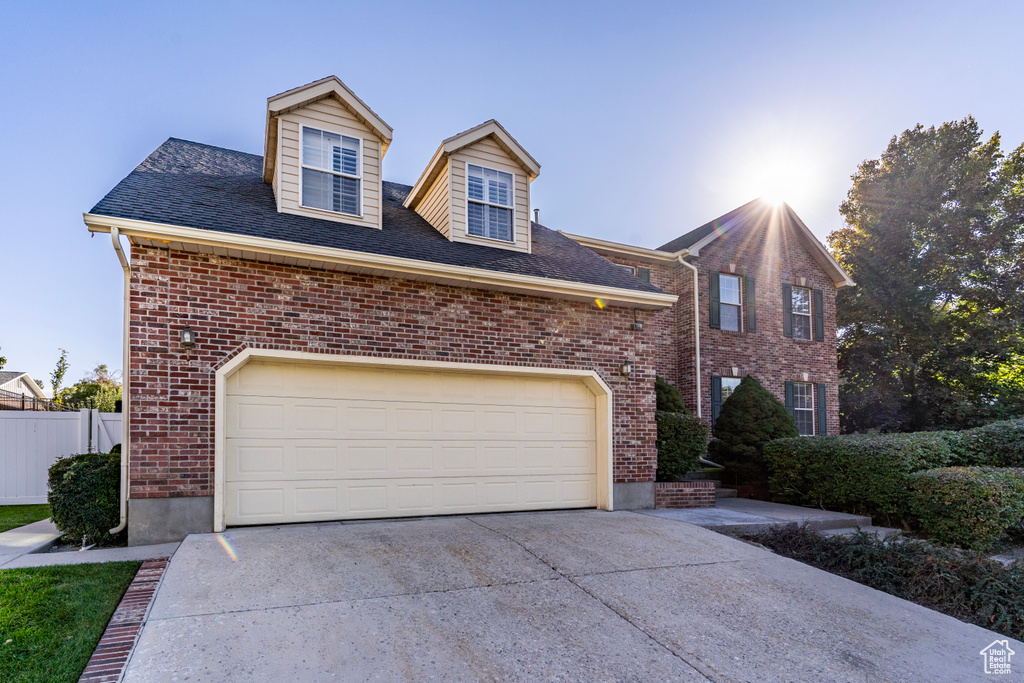 View of front facade featuring a garage