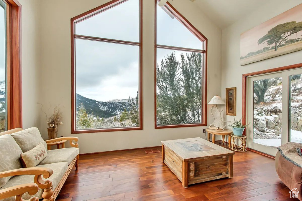 Sunroom / solarium with vaulted ceiling and a mountain view