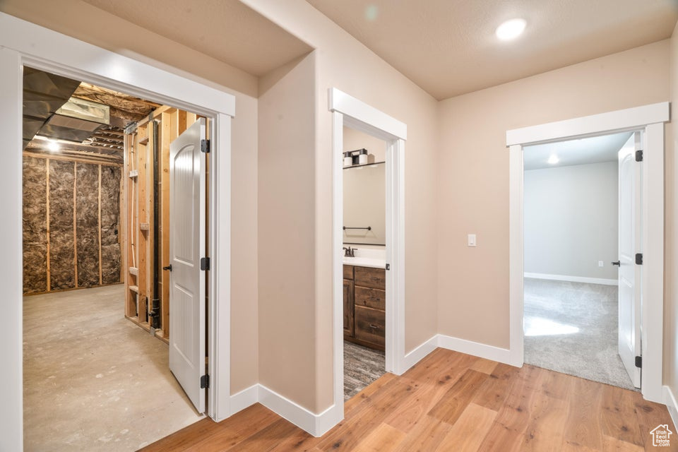 Corridor featuring light hardwood / wood-style flooring