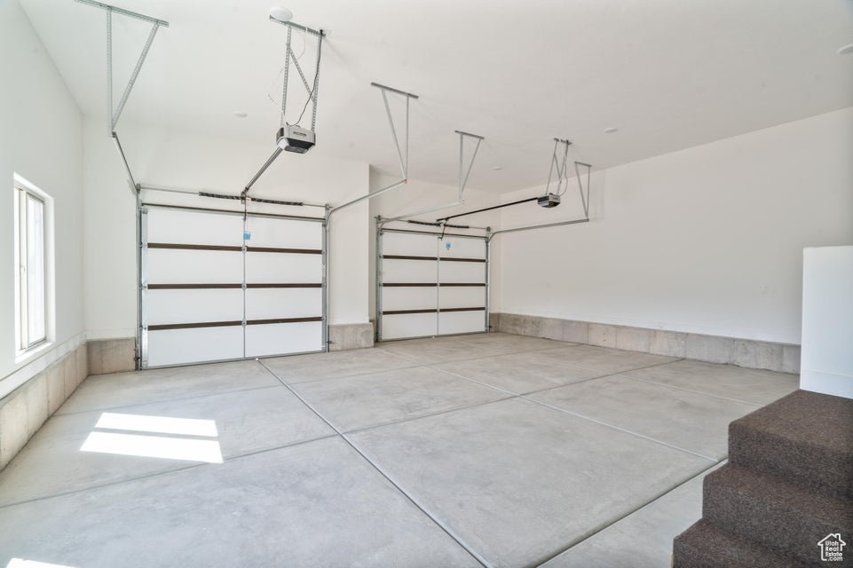 Garage featuring a garage door opener