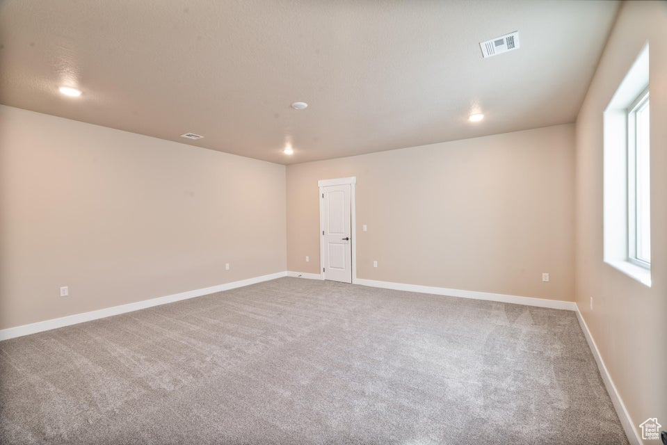 Spare room featuring carpet floors