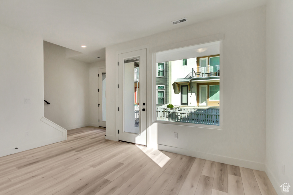 Entrance foyer featuring light wood-type flooring