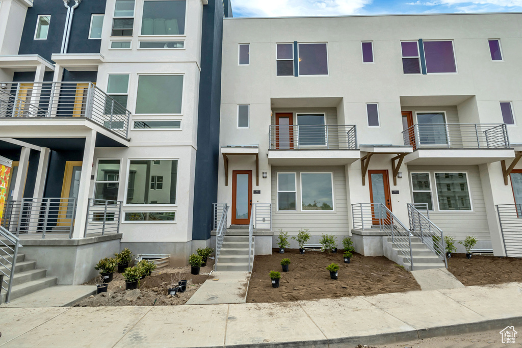 View of property featuring stucco siding