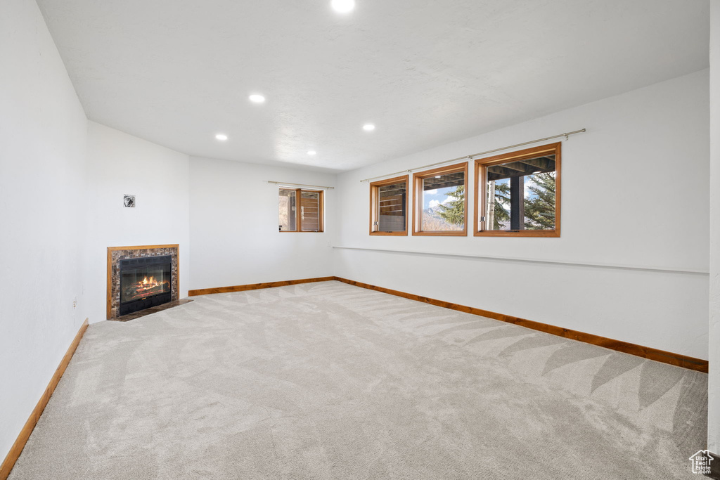 Unfurnished living room with carpet floors