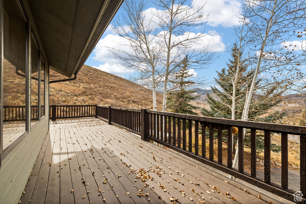 Wooden deck featuring a mountain view