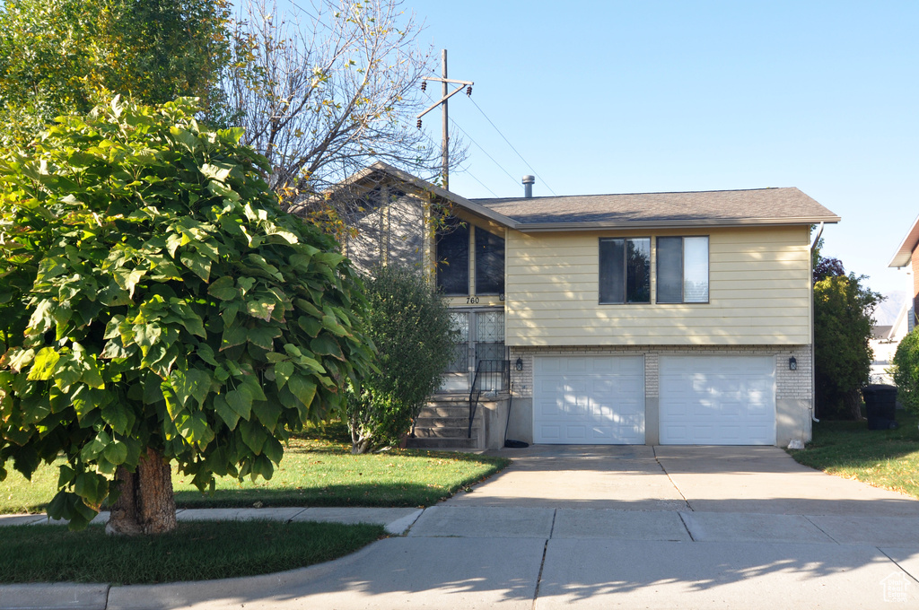 View of front facade featuring a garage