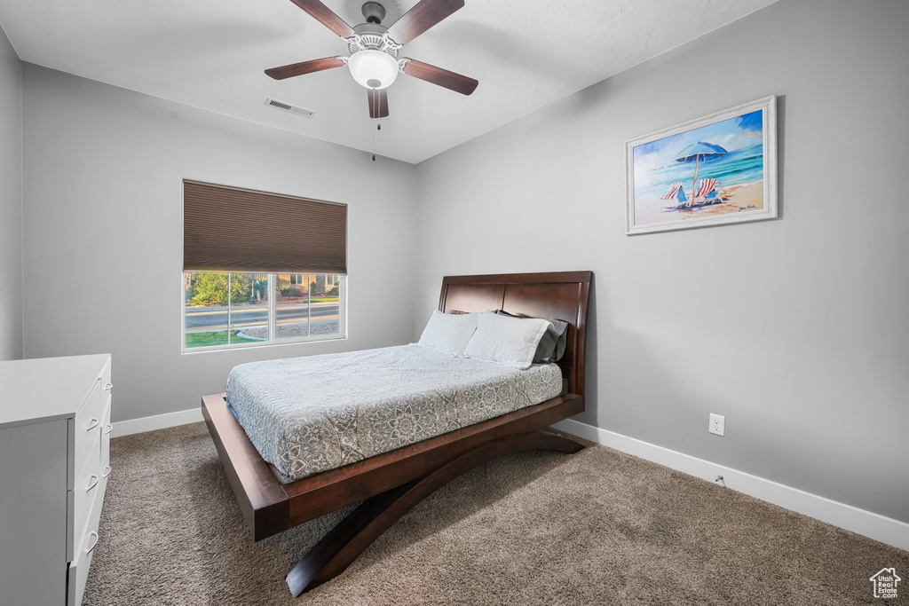 Bedroom with carpet and ceiling fan