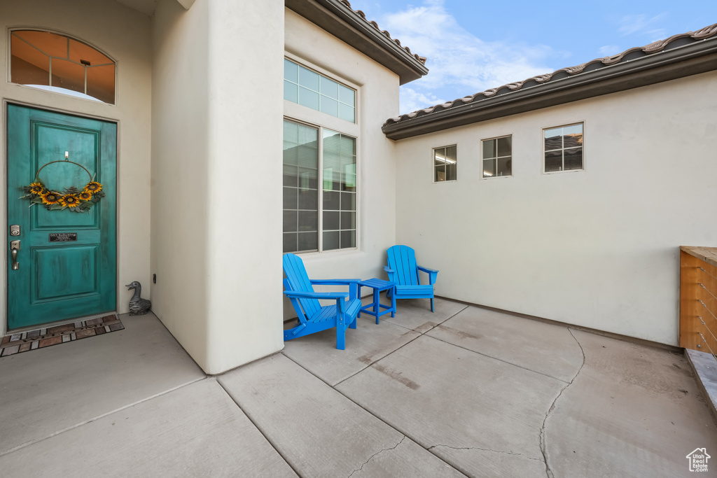 Property entrance with a patio area