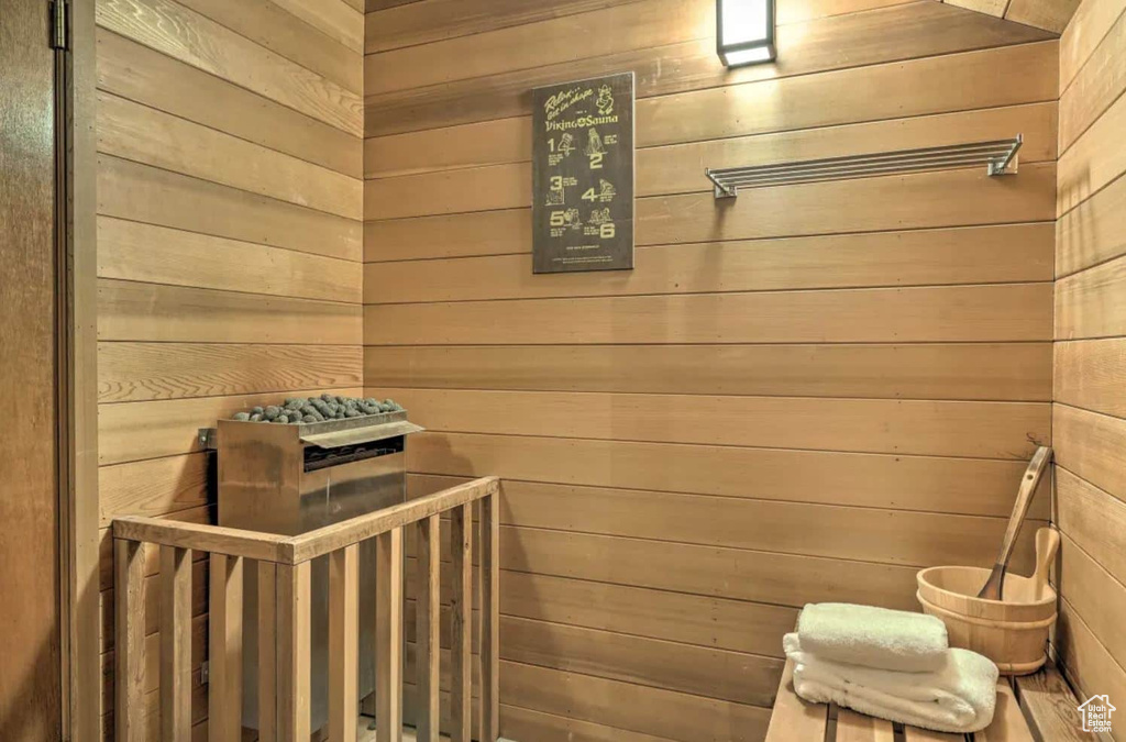 View of sauna / steam room featuring wooden walls