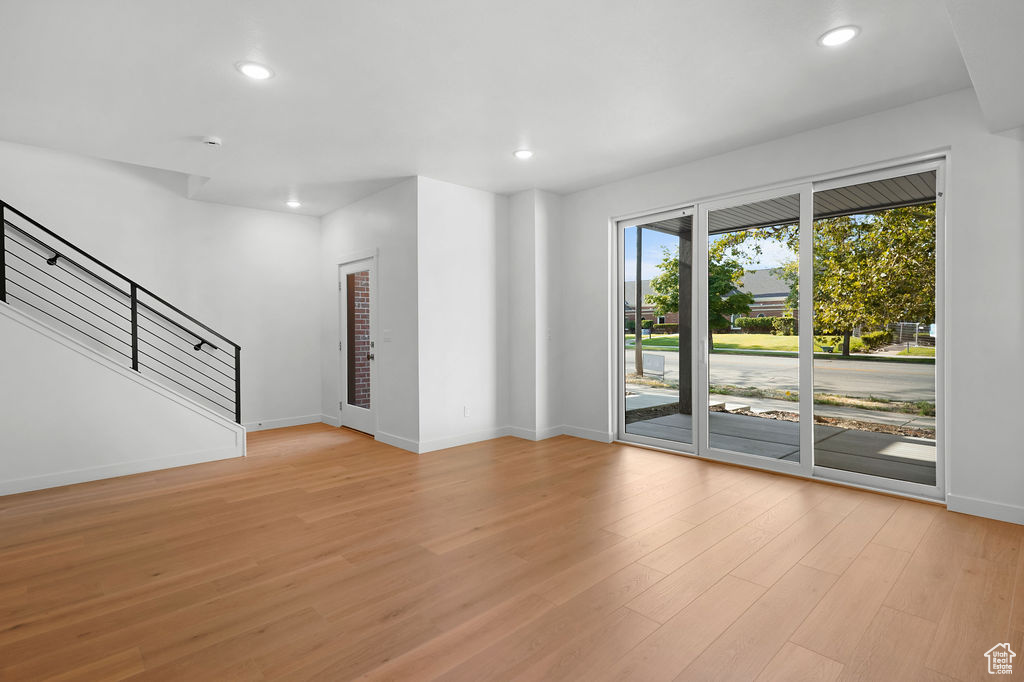 Unfurnished room with light hardwood / wood-style flooring