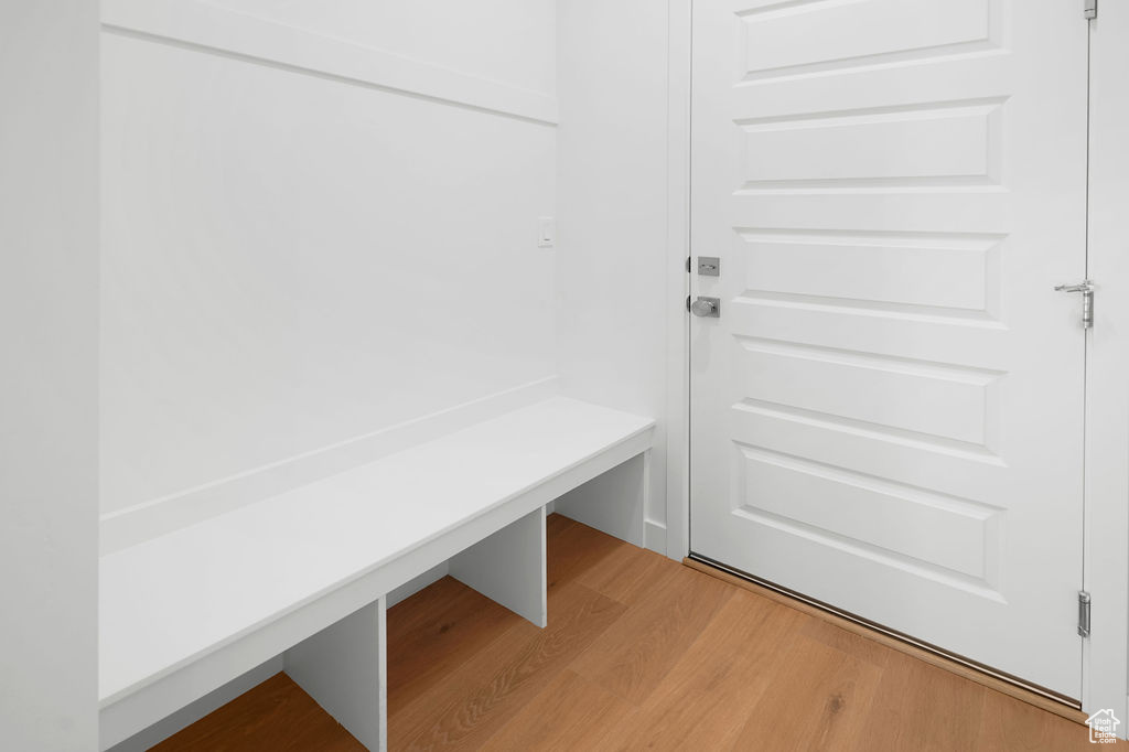 Mudroom with light hardwood / wood-style flooring