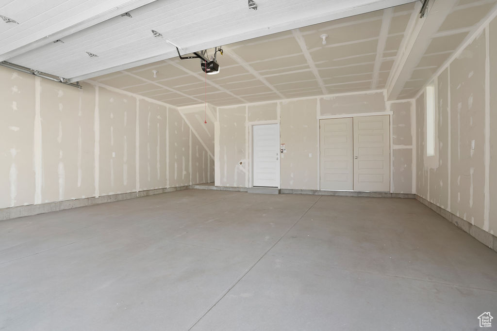 Garage featuring a garage door opener