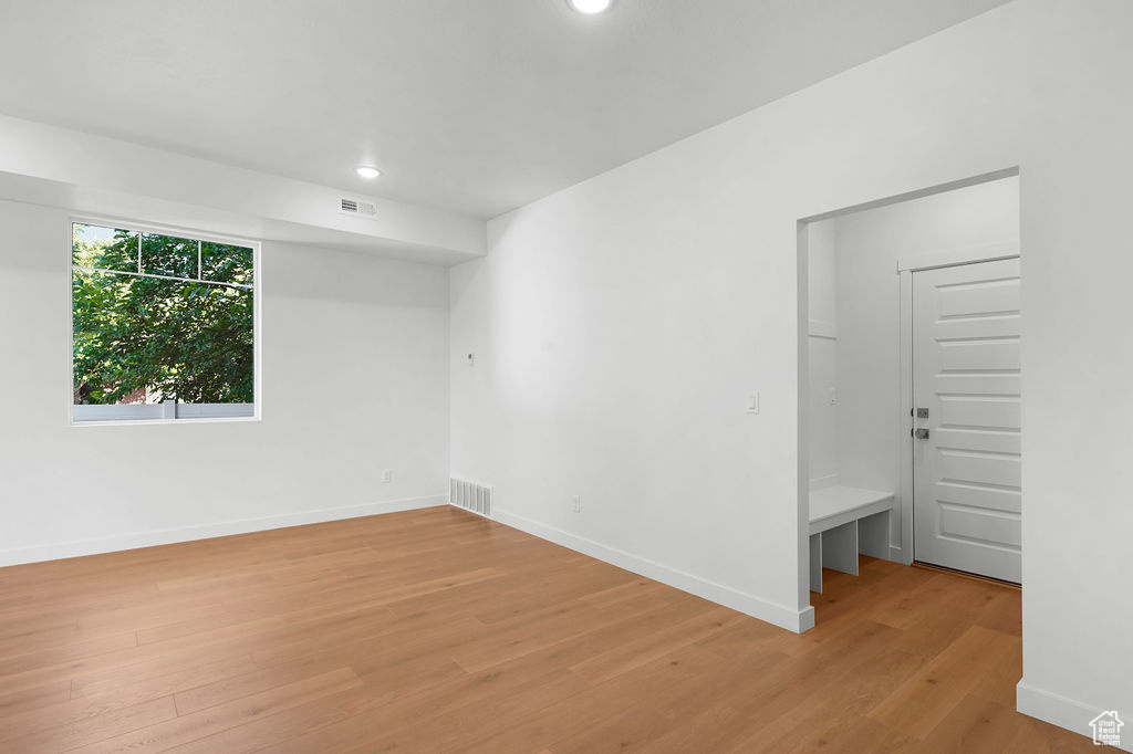 Empty room featuring light wood-type flooring