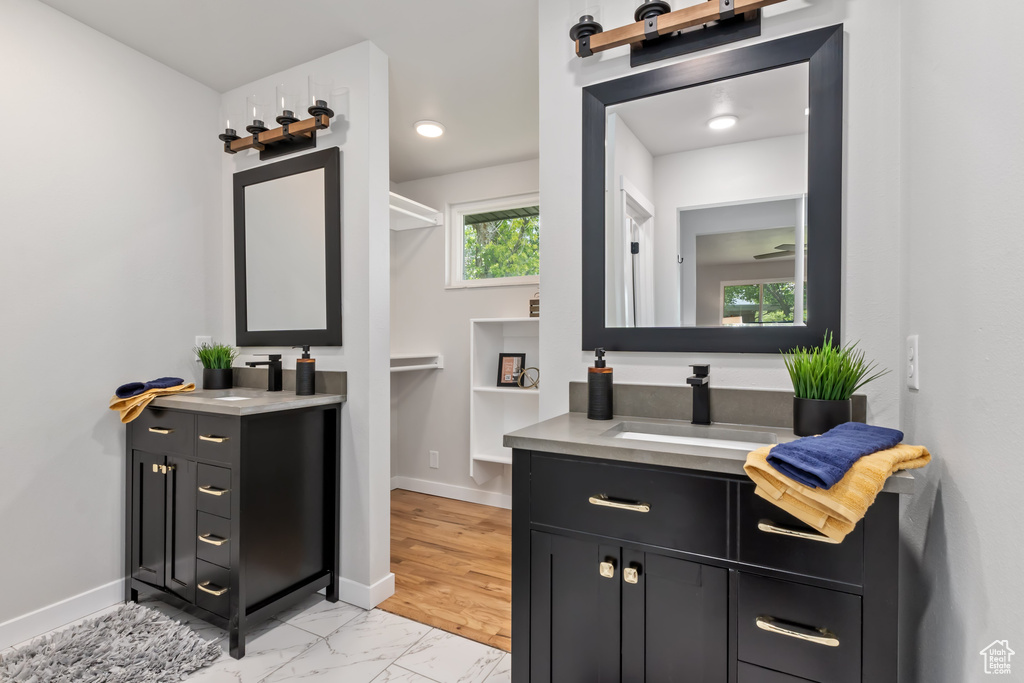 Bathroom with vanity and wood-type flooring