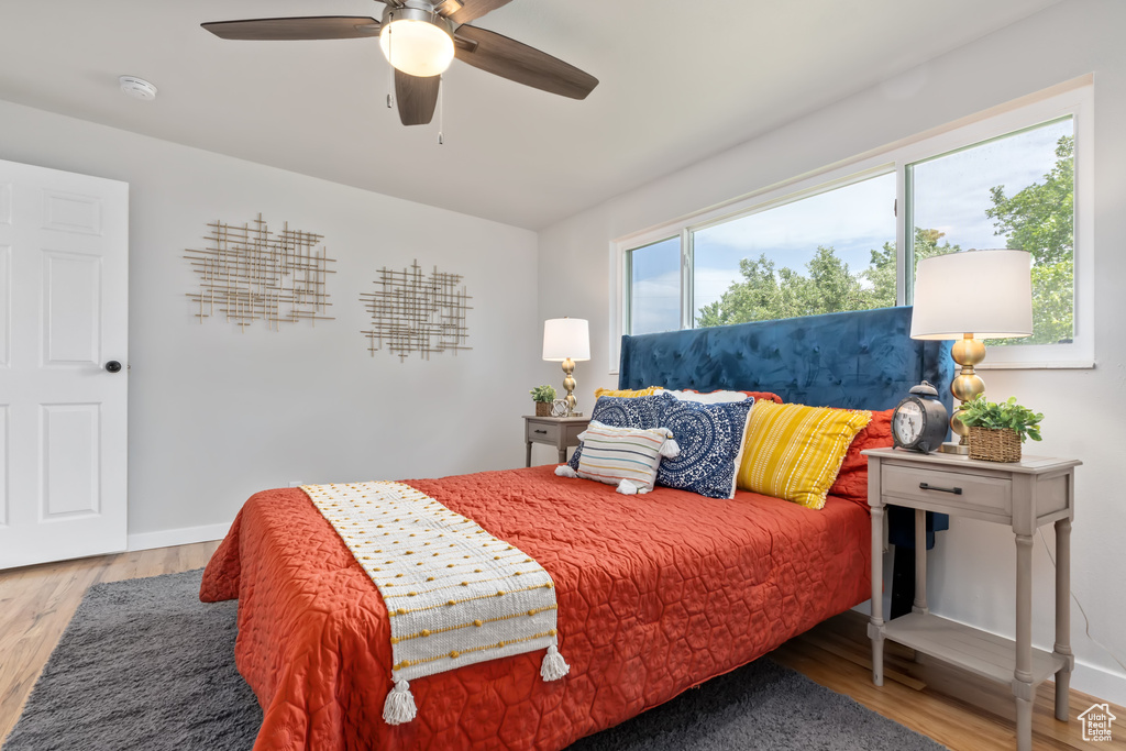 Bedroom featuring light hardwood / wood-style floors and ceiling fan