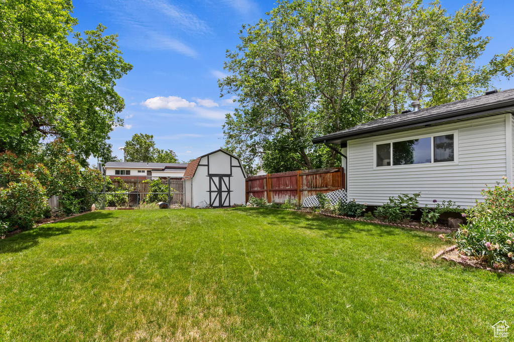 View of yard with a storage shed