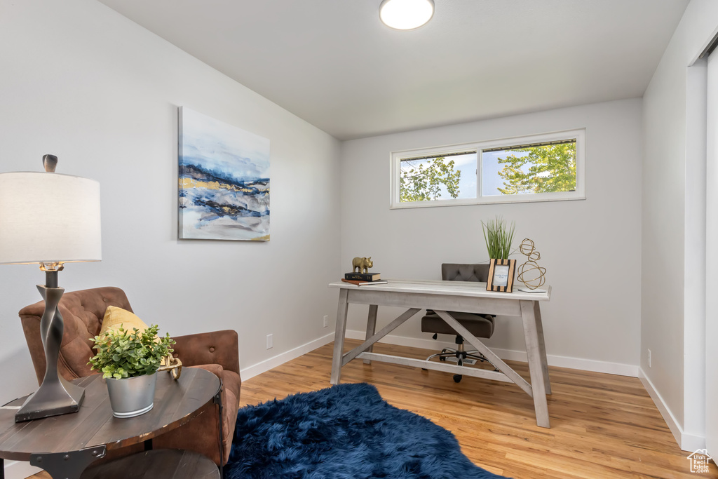 Office with hardwood / wood-style flooring