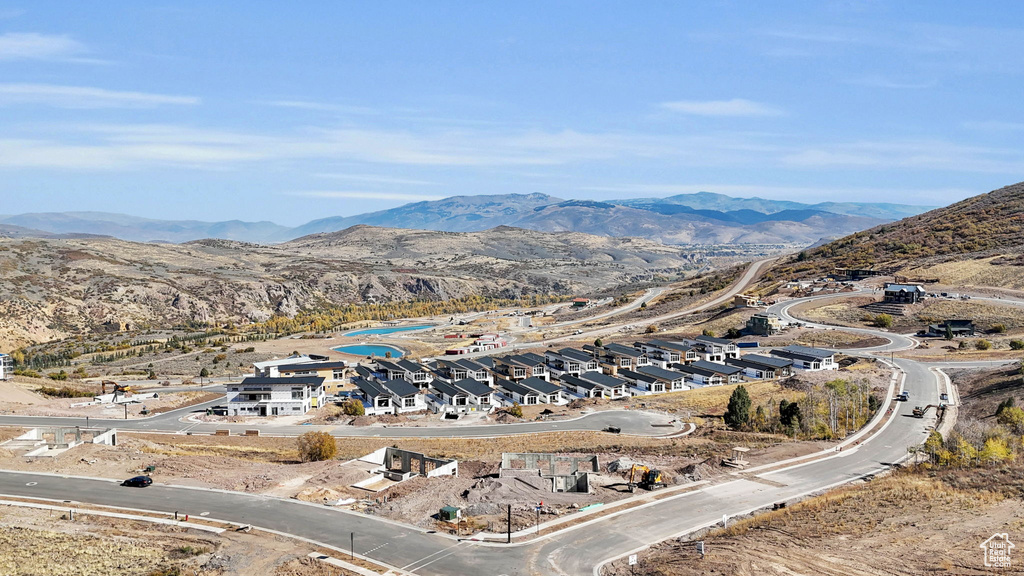 Birds eye view of property with a mountain view