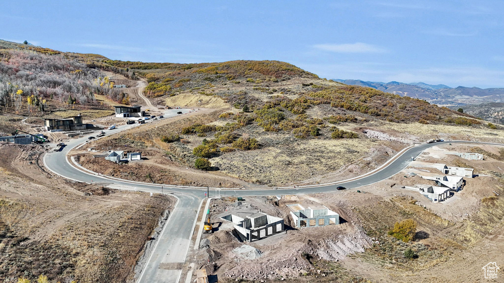 Birds eye view of property with a mountain view