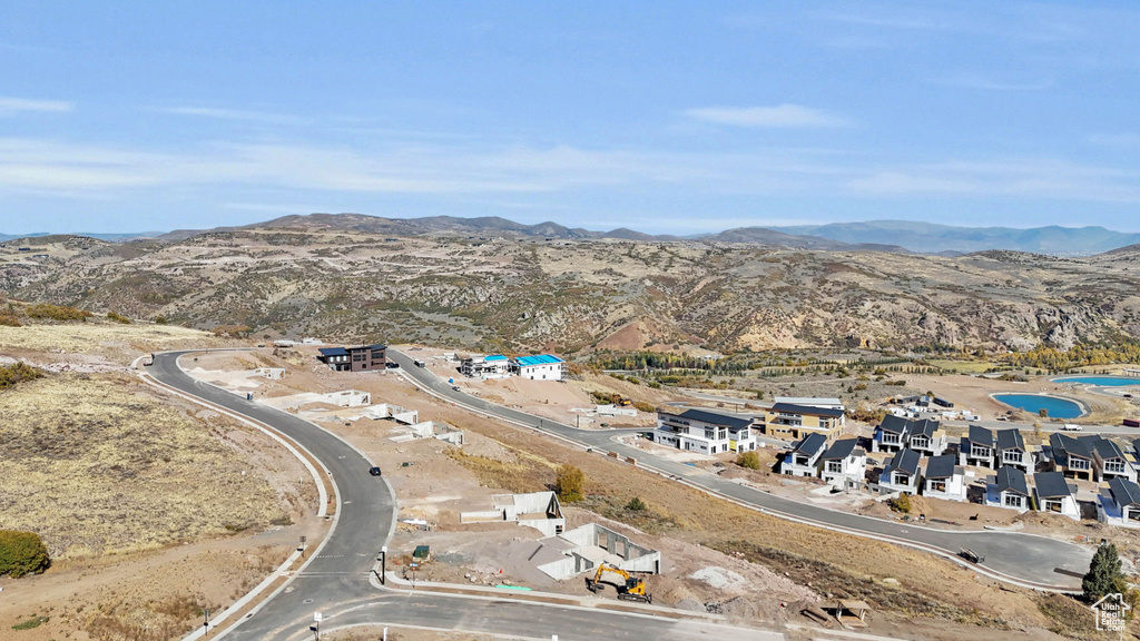 Birds eye view of property with a mountain view