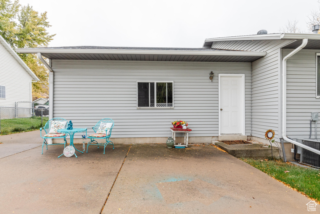 Back of property featuring a patio and central AC