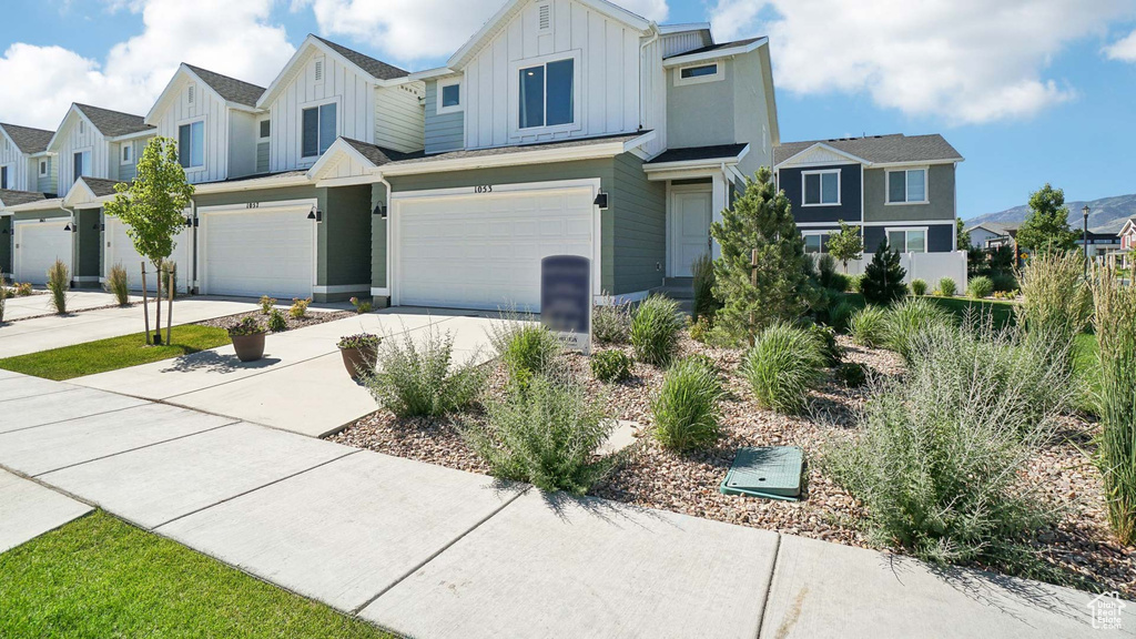 View of property with a garage