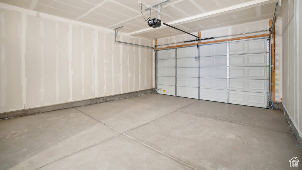 Garage featuring a garage door opener