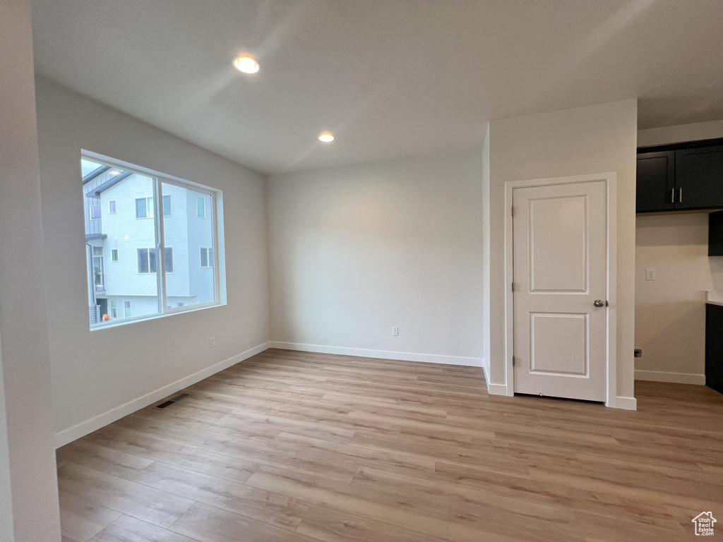 Unfurnished room featuring light wood-type flooring