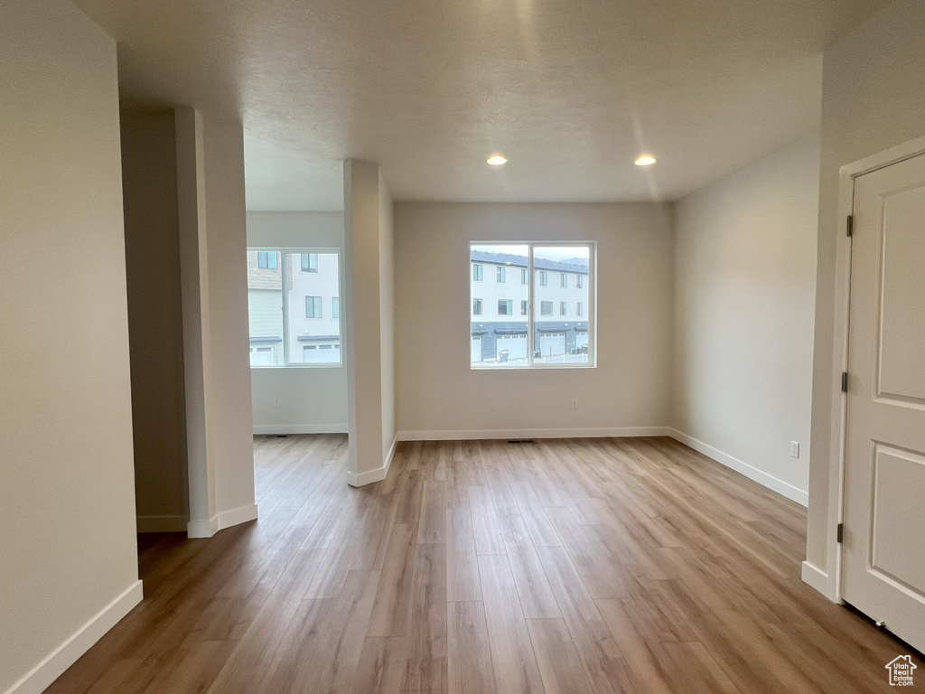 Empty room featuring light wood-type flooring