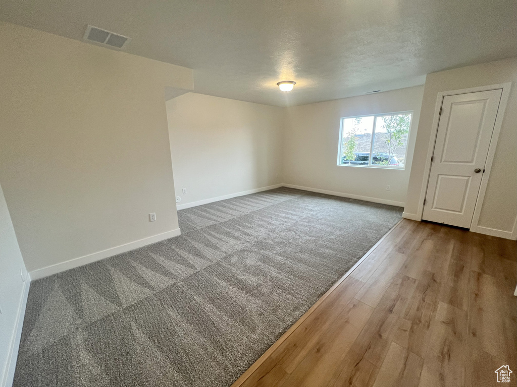 Spare room with wood-type flooring