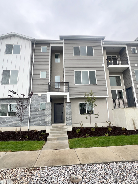 View of front of property featuring a balcony