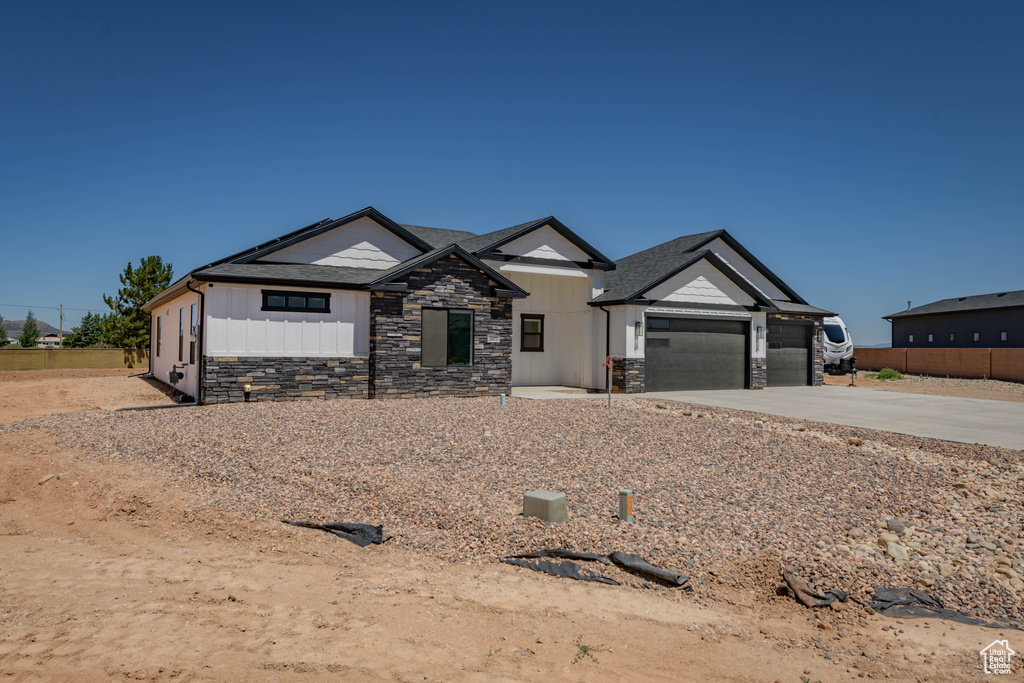 View of front of property featuring a garage