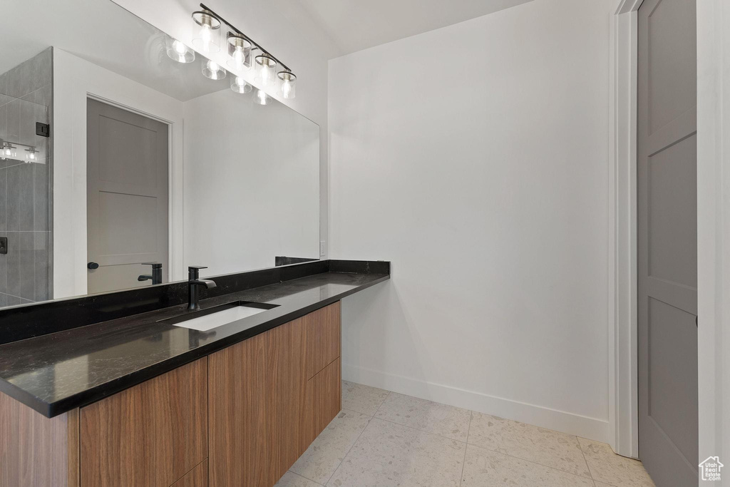 Bathroom featuring vanity and tile patterned flooring