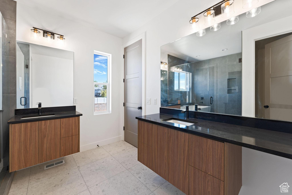 Bathroom with vanity and walk in shower