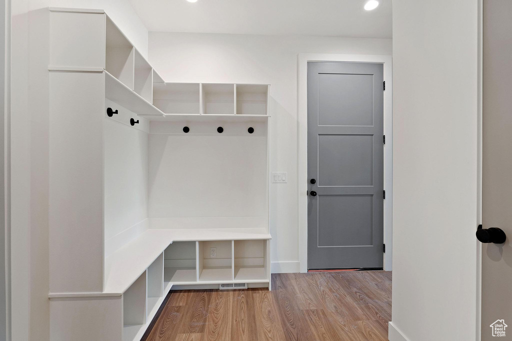 Mudroom featuring wood-type flooring