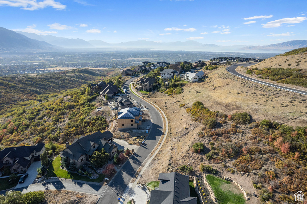 Birds eye view of property with a mountain view