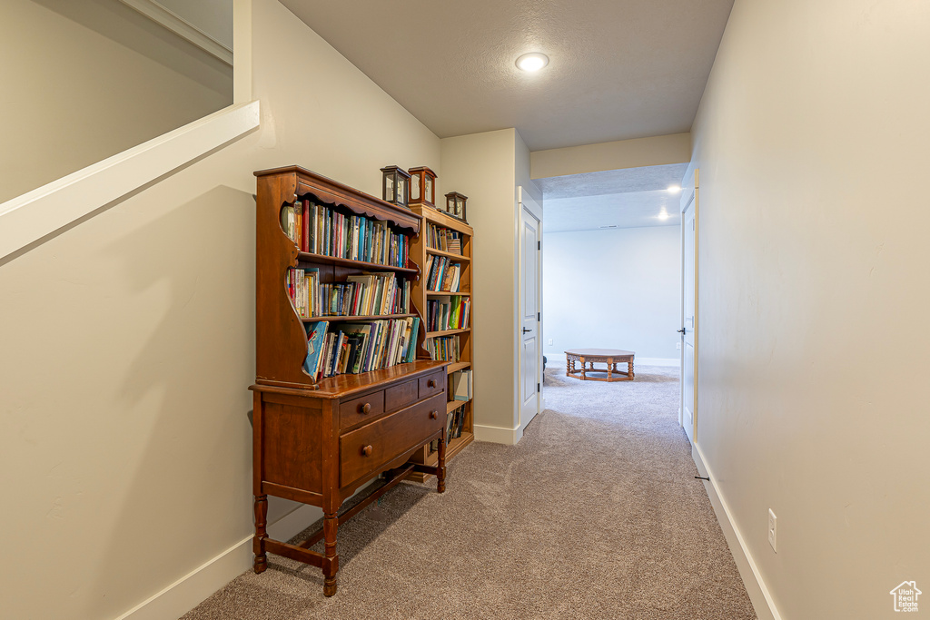 Hall with light colored carpet