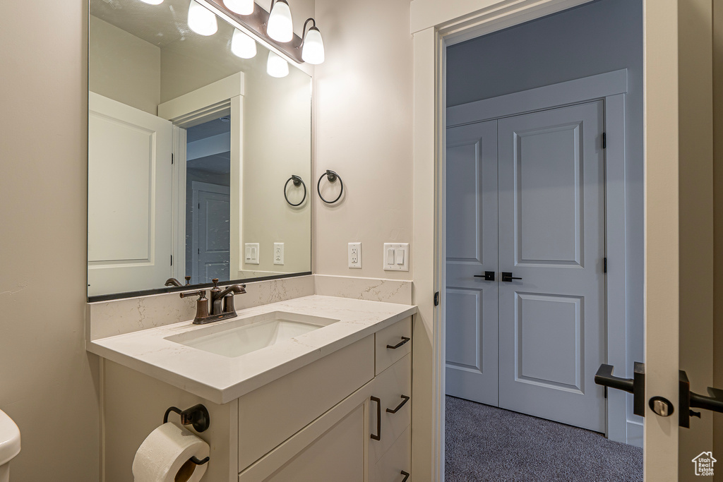 Bathroom with vanity and toilet