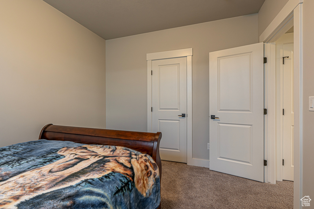 Bedroom with carpet