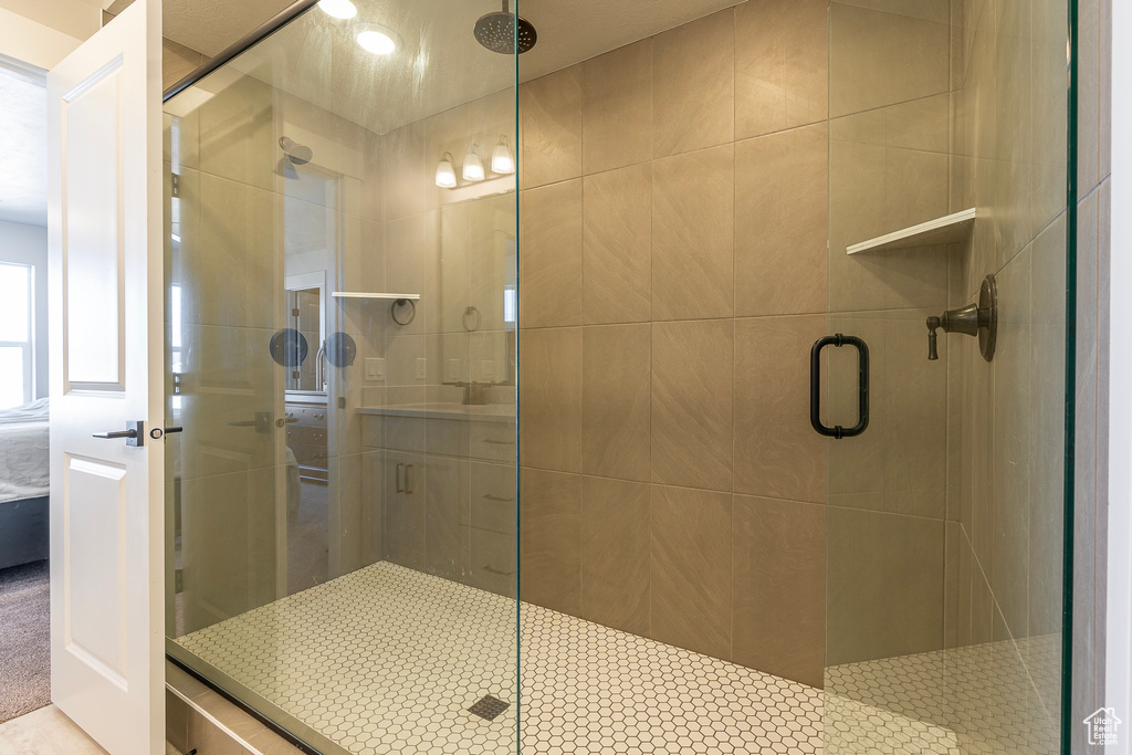 Bathroom featuring a shower with shower door