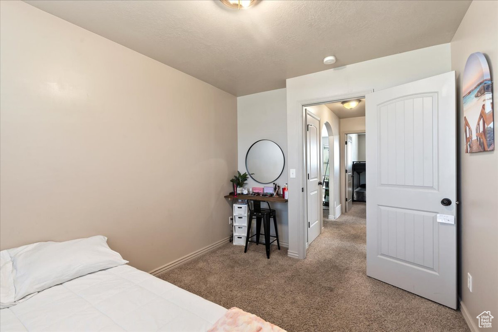 Bedroom featuring carpet flooring