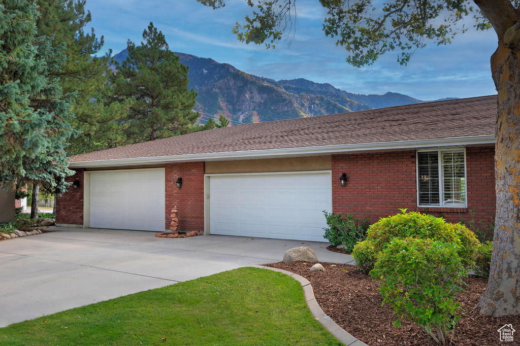 Exterior space featuring a garage and a mountain view