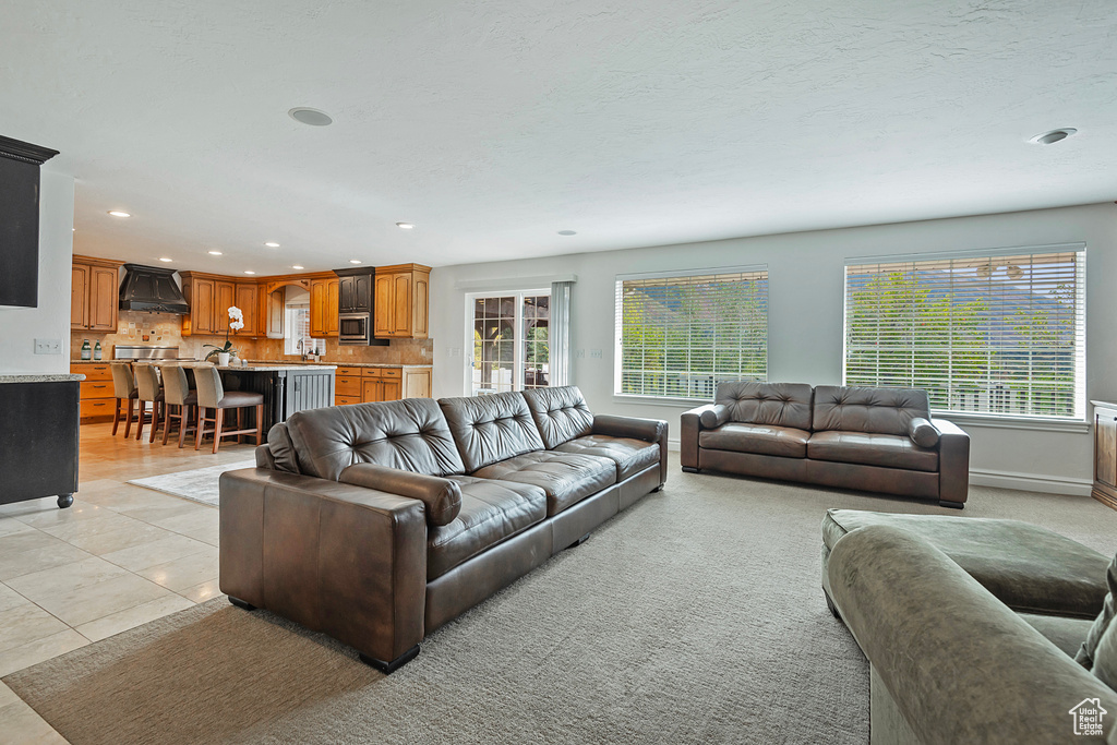 Living room featuring light tile patterned floors